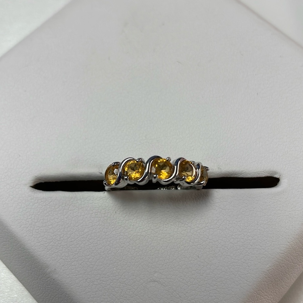 Sterling Silver ring with yellow glass from Ultimate Trading Corporation.
